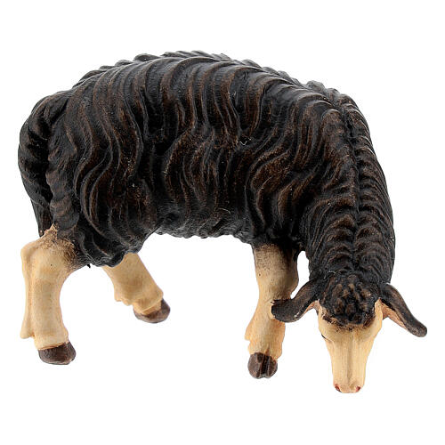Owca czarna jedząca drewno malowane Val Gardena szopka Rainell 11 cm 1