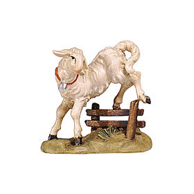 Lamb jumping over fence, 9 cm nativity Rainell, in painted Valgardena wood