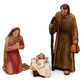 Nativity scene set in painted resin with musician 20 cm