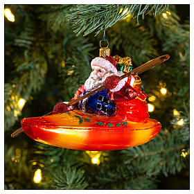 Santa Claus in Kayak Christmas ornament blown glass