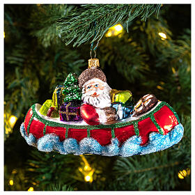 Santa Claus in Canoe Christmas Tree Ornament blown glass