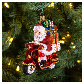 Christmas tree decoration Santa Claus on a motor-scooter in blown glass