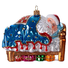 Short winter nap of Santa Claus, blown glass Christmas ornament
