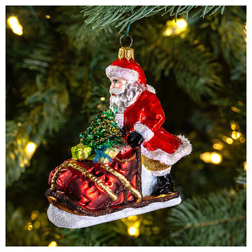 Blown glass Christmas ornament, Santa Claus sledding 2