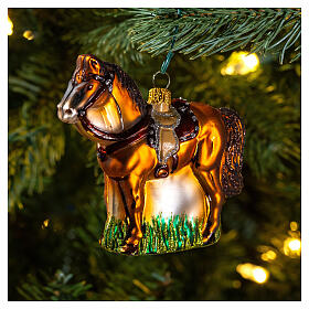 Blown glass Christmas ornament, saddled horse