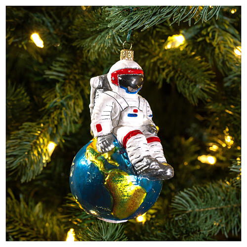 Astronaut sitting on Earth Christmas tree ornament in blown glass 2