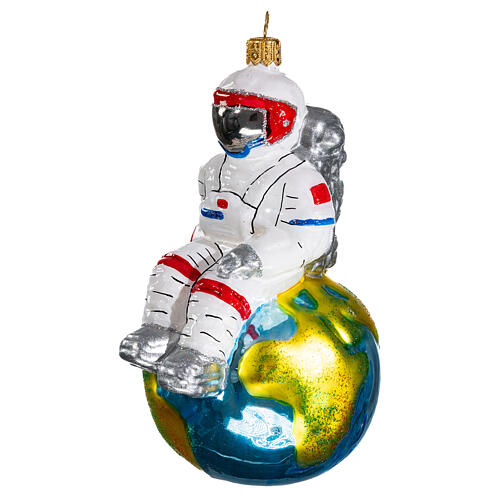 Astronaut sitting on Earth Christmas tree ornament in blown glass 3