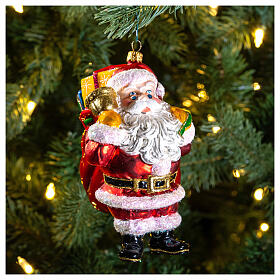 Santa carrying gifts, Christmas tree decoration, blown glass