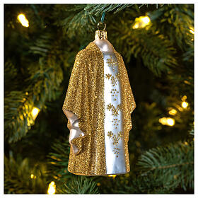 Golden priest chasuble, blown glass Christmas ornaments