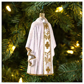 White priest chasuble, blown glass Christmas ornaments