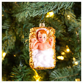 Baby Jesus in manger blown glass Christmas ornament 10 cm