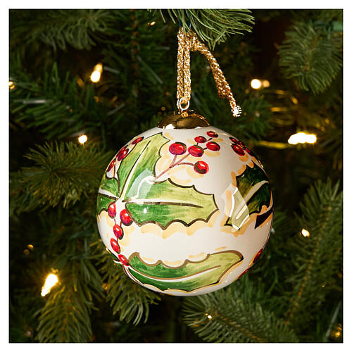 Hand-painted Christmas ball by Dellarte Ceramiche, green holly and red berries, 4 in 2