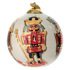 Hand-painted Dellarte Ceramiche Christmas bauble, nutcracker themed ivory base, 3 in