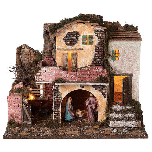 Village with masonry porch, lights and fire 40x45x30 cm with 10 cm Holy Family 1