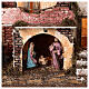 Village with masonry porch, lights and fire 40x45x30 cm with 10 cm Holy Family s2