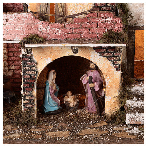 Aldeia com pórtico e muros de tijolos, luzes e fogo, Natividade figuras altura média 10 cm; medidas: 38x45x30 cm 2