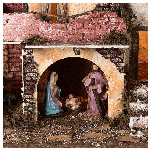 Village with brick walls lights and fire 40x45x30 cm Nativity 10 cm 2