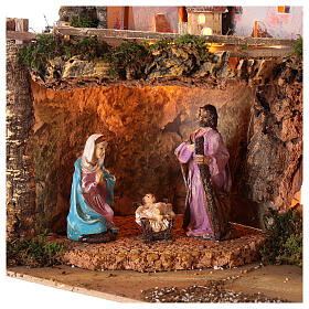 Presépio com luzes e Natividade de Jesus, figuras altura média 10 cm, medidas: 50x23x34 cm