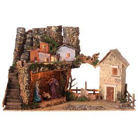 Nativity village 50x25x35 cm with lights and Holy Family 10 cm