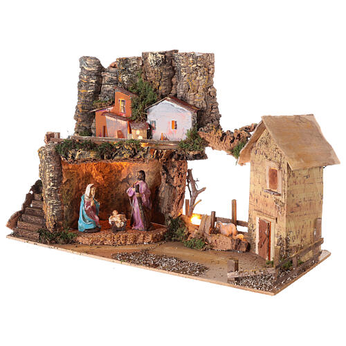 Nativity village 50x25x35 cm with lights and Holy Family 10 cm 3