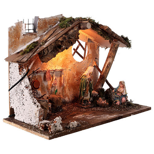 Cabaña belén con Natividad 16 cm con luces y fuego 50x25x35 5