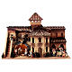 Aldeia casa octogonal e poço para presépio Moranduzzo com figuras altura média 10 cm; medidas: 50x70x45 cm s1