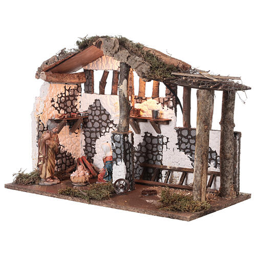 Stable with 16 cm Nativity set, wood and cork, light and fire, 35x50x30 cm 2