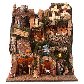 Multi-storey Nativity village with mill, illuminated, for 10 cm characters, 60x50x45 cm