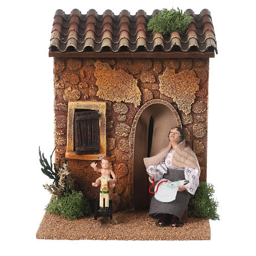 Woman embroidering and child on a rocking horse, animated Nativity Scene of 10 cm, 20x15x15 cm 1