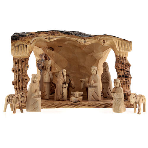 Stajenka ze Sceną Narodzin, pień drewno oliwne, 11 figurek 10 cm, Betlemme, 20x30x20 cm 1