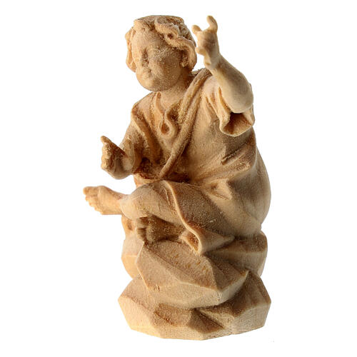 Bambino seduto al falò presepe Montano Cirmolo legno 10 cm 2