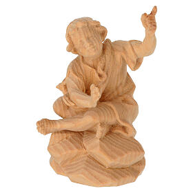 Child sitting by the fire, Swiss pinewood statue of 12 cm for Mountain Nativity Scene