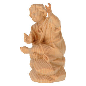 Child sitting by the fire, Swiss pinewood statue of 12 cm for Mountain Nativity Scene