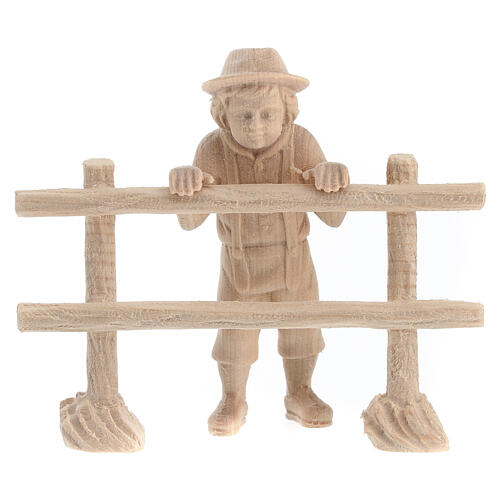 Child looking beyond a fence for 12 cm Mountain Nativity Scene, natural Swiss pinewood, set of 2 1