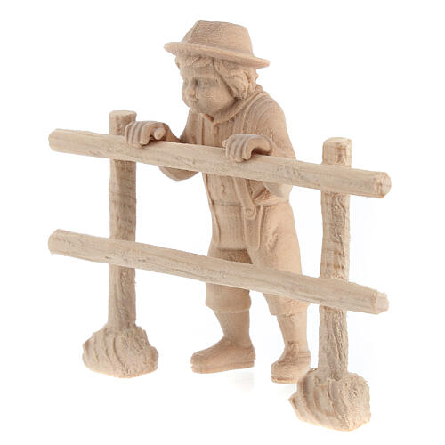 Child looking beyond a fence for 12 cm Mountain Nativity Scene, natural Swiss pinewood, set of 2 2
