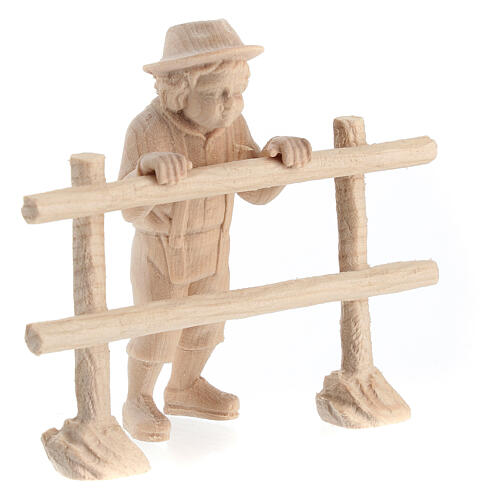 Child looking beyond a fence for 12 cm Mountain Nativity Scene, natural Swiss pinewood, set of 2 3
