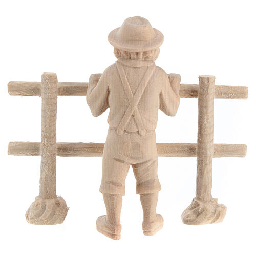 Child looking beyond a fence for 12 cm Mountain Nativity Scene, natural Swiss pinewood, set of 2 6