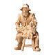 Shepherd sitting in Mountain Pine natural wood 10 cm nativity s1