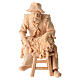 Shepherd sitting in Mountain Pine natural wood 10 cm nativity s1