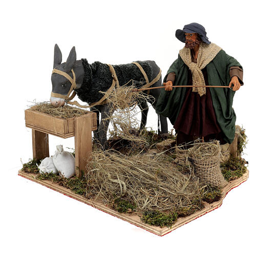 Farmer feeding his donkey, ANIMATED character of 24 cm for Neapolitan Nativity Scene 2