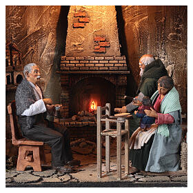 Feeding baby scene with lighted fireplace, 30 cm nativity scene 60x50x40