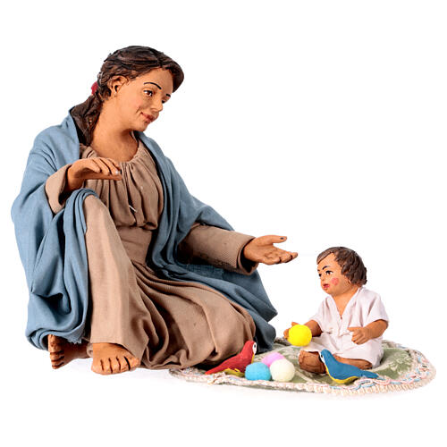 Mother playing with her child on the ground, terracotta figurine for 30 cm Neapolitan Nativity Scene 1