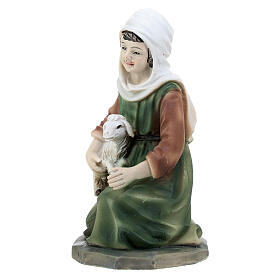 Shepherdess with lamb on her knees in colored resin, nativity scene h 12 cm
