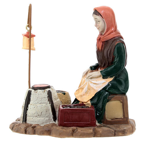 Woman roasting chestnuts for Nativity Scene with 10 cm resin figurines 1