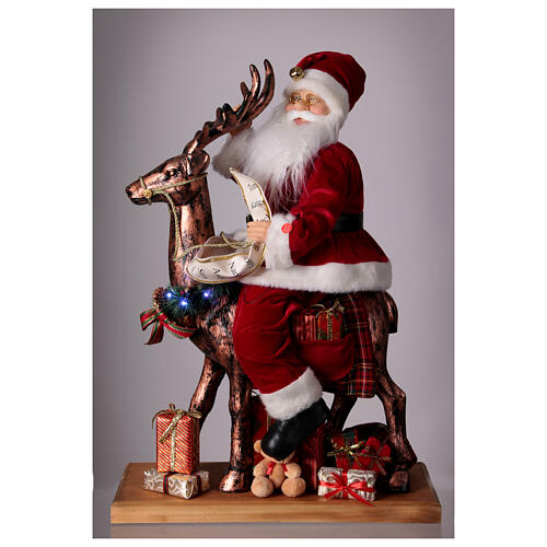 Père Noël avec elfe traineau lumières mouvement musique 55x80x20 cm 2