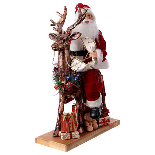 Père Noël avec elfe traineau lumières mouvement musique 55x80x20 cm 4