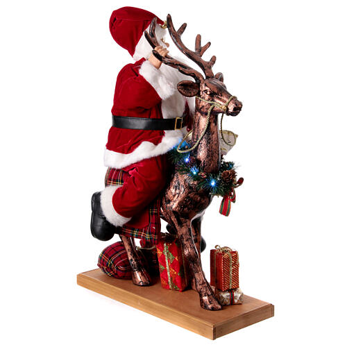 Père Noël avec elfe traineau lumières mouvement musique 55x80x20 cm 6