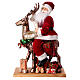 Père Noël avec elfe traineau lumières mouvement musique 55x80x20 cm s1