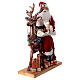 Père Noël avec elfe traineau lumières mouvement musique 55x80x20 cm s4