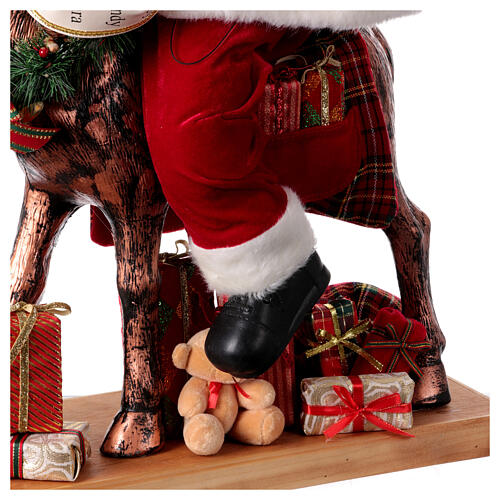 Babbo Natale con elfo slitta luci movimento musica 55x80x20 cm 8